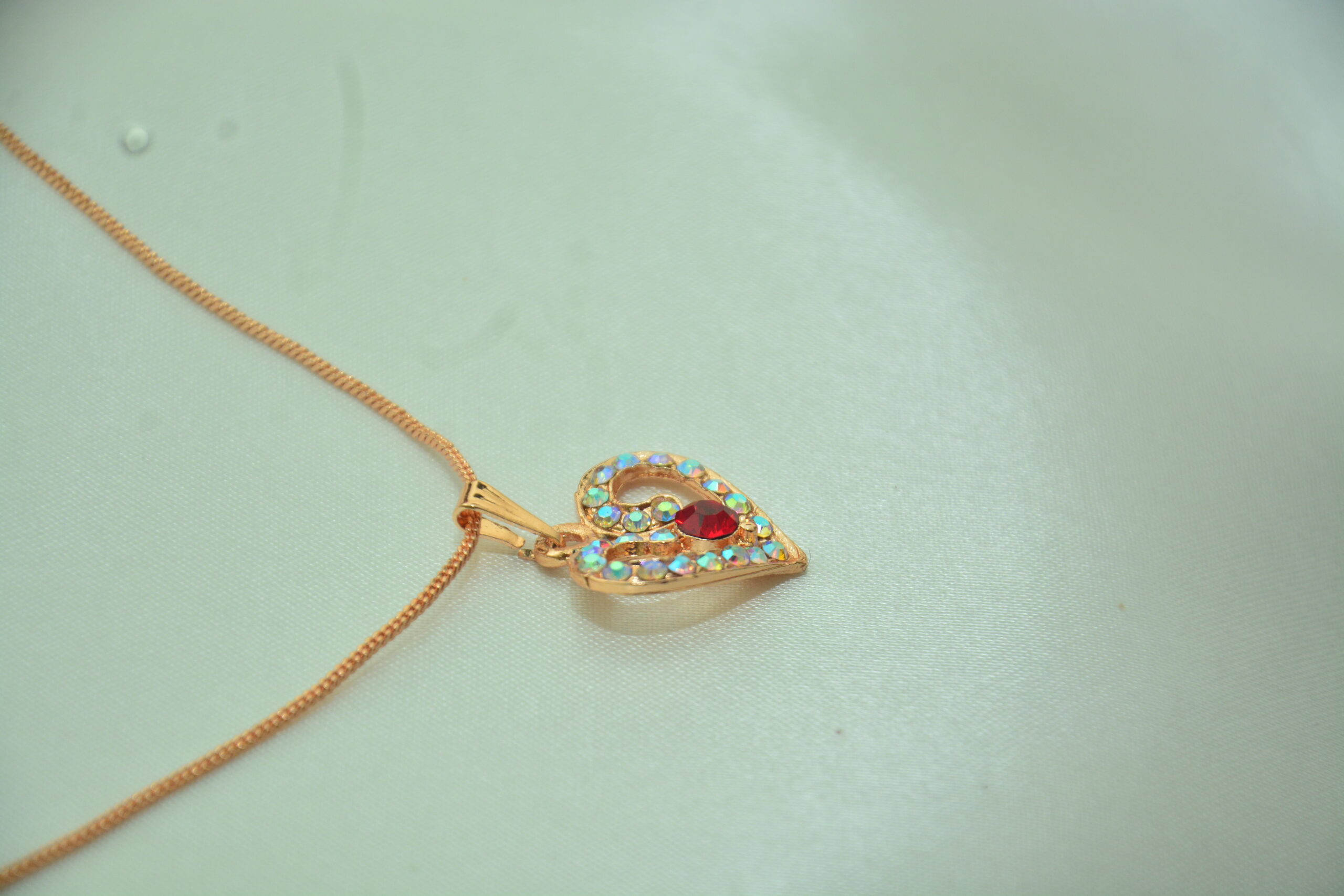 Rose Gold Heart Pendant with Red Stone - Image 2